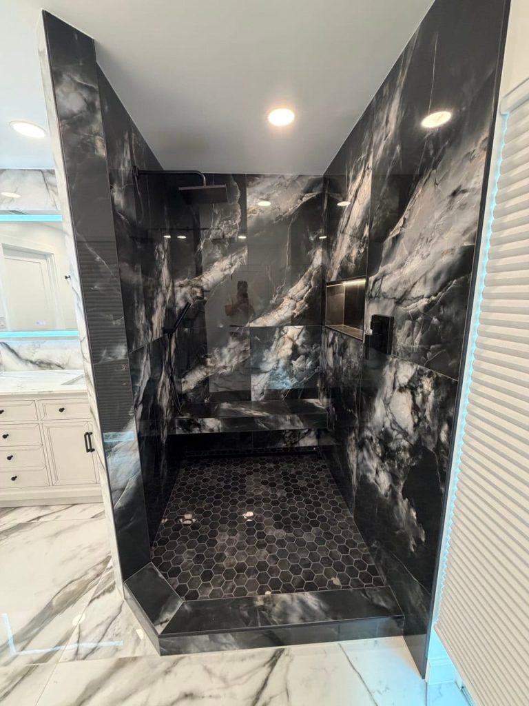 Shower With a Built-In Bench in Black Marble-Look Tile
