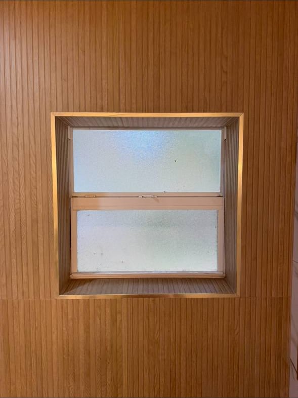 Fluted Wood-Look Wall With Brass Trim