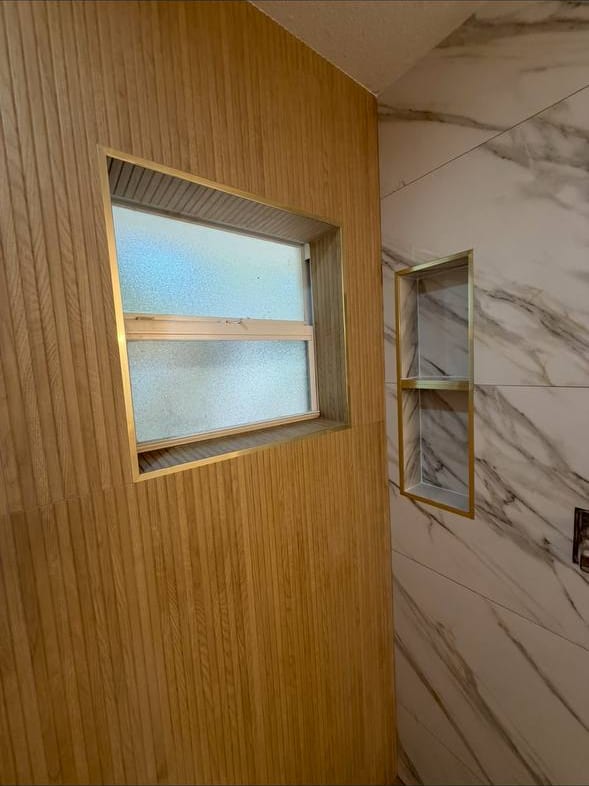 Fluted Wood-Look Wall With Brass Trim