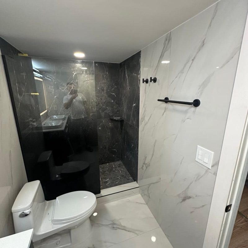Charcoal Marble-Look Shower in a White Marble-Look Bathroom