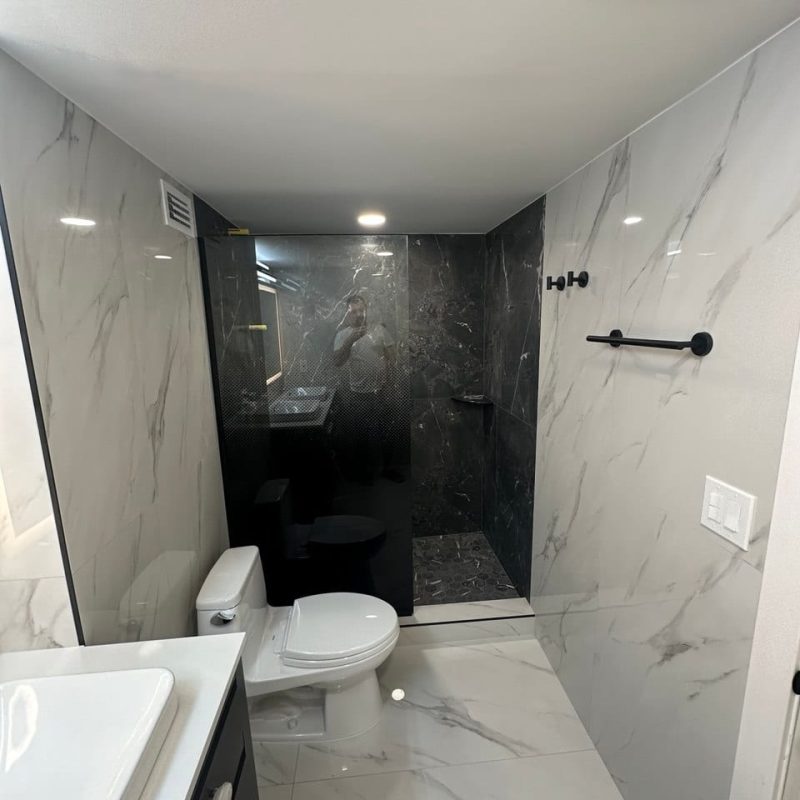 Charcoal Marble-Look Shower in a White Marble-Look Bathroom