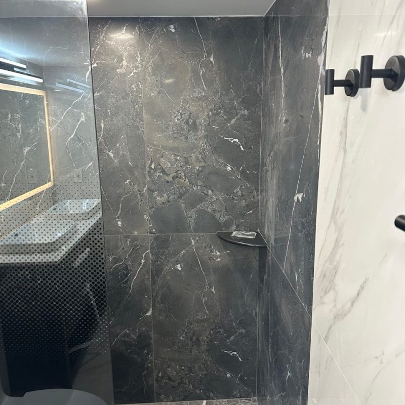 Charcoal Marble-Look Shower in a White Marble-Look Bathroom
