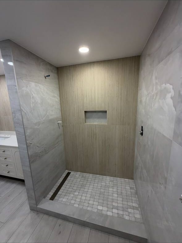 Walk-In Shower With a Fluted Accent Wall